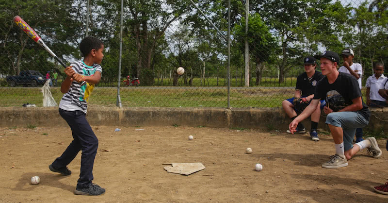 GBA Players providing a free baseball clinic to local kids in the Dominican republic